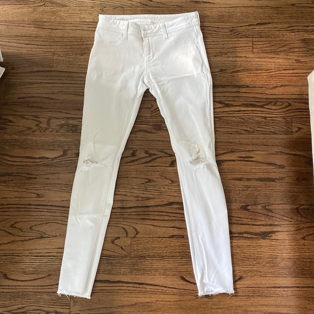 DL1961 hybrid white denim distressed jean - 4 way stretch. Holes at knee